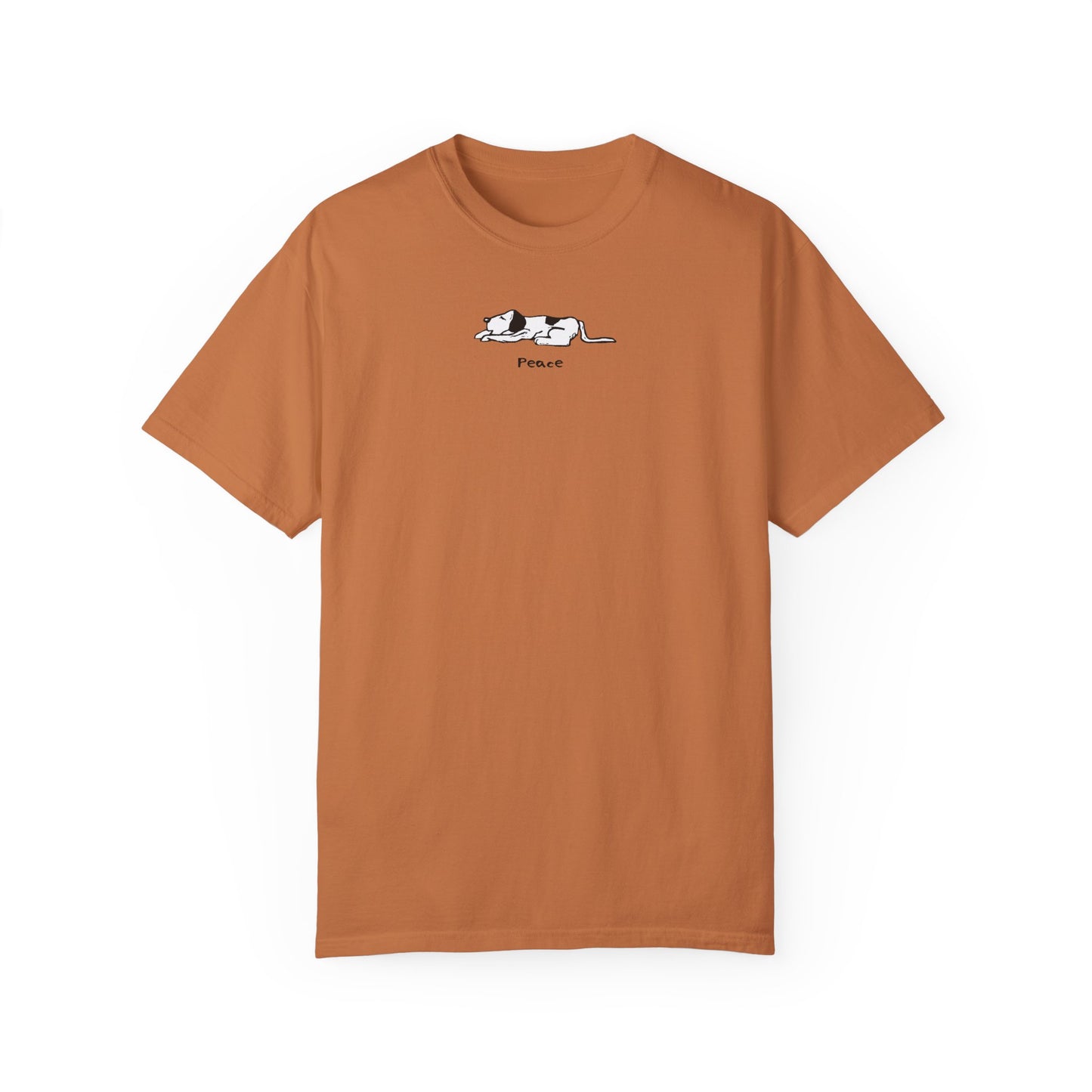 Rust-colored or yam-colored unisex t-shirt featuring a simple black and white illustration of a sleeping dog above the word "Peace" printed on the chest.