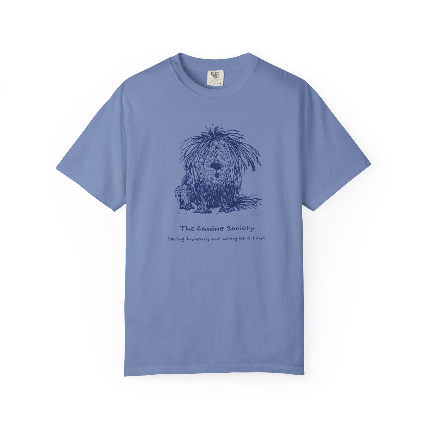 Washed-denim colored unisex t-shirt featuring a linoleum print image of a shaggy dog in dark blue ink. Text below the image reads "The Canine Society" and "Saving humans, one being at a time."