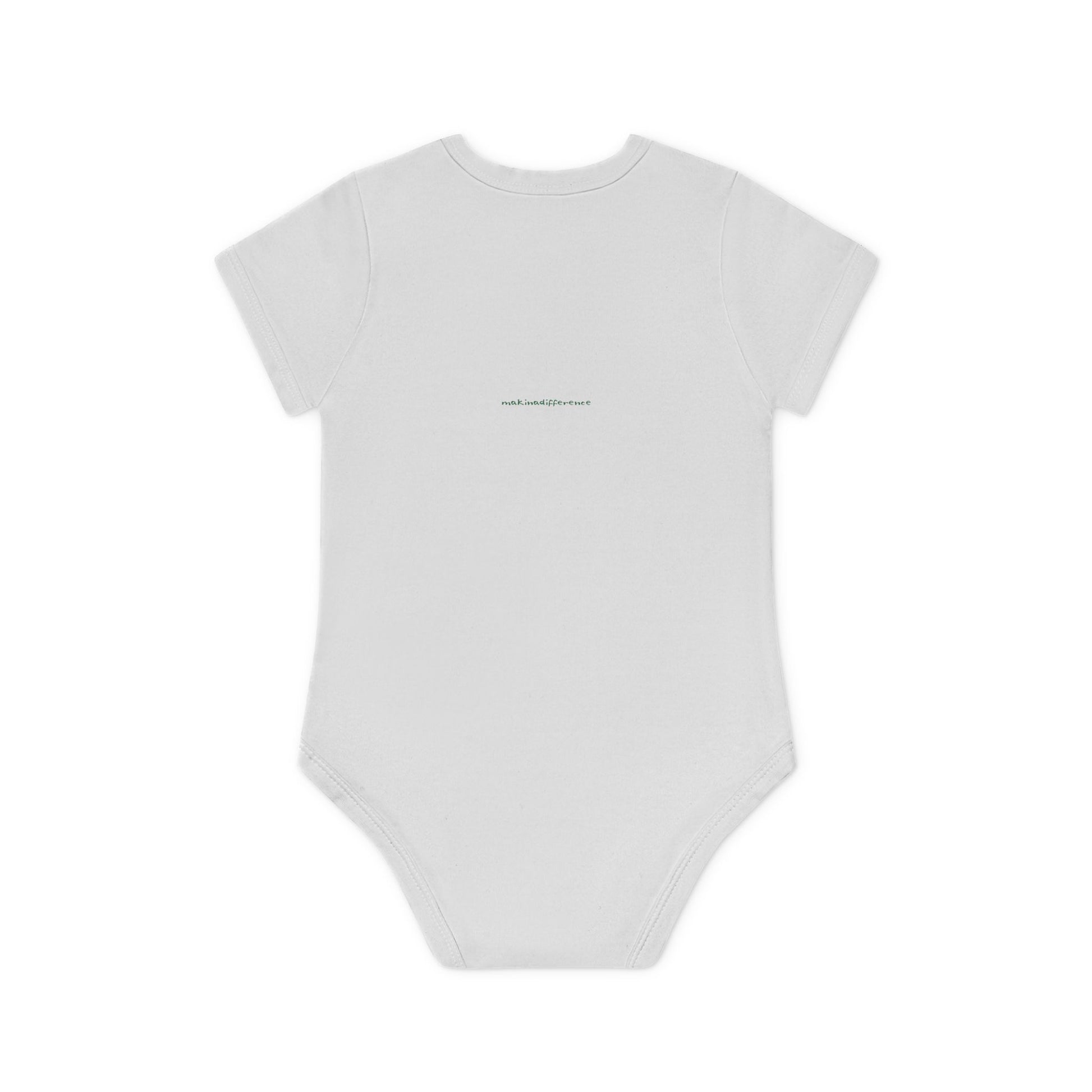 White baby onesie viewed from the back, featuring small, centered text near the upper back that reads "makinadifference.net" in a simple, dark font.