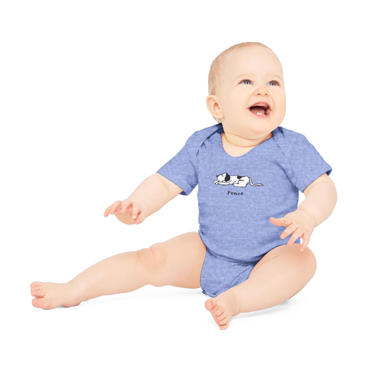 Heather blue short-sleeve onesie baby bodysuit on a smiling baby sitting up with arm outstretched in front, with head turned and looing up. Onesie features a simple black and white illustration of a sleeping dog above the word "Peace" printed on the chest.