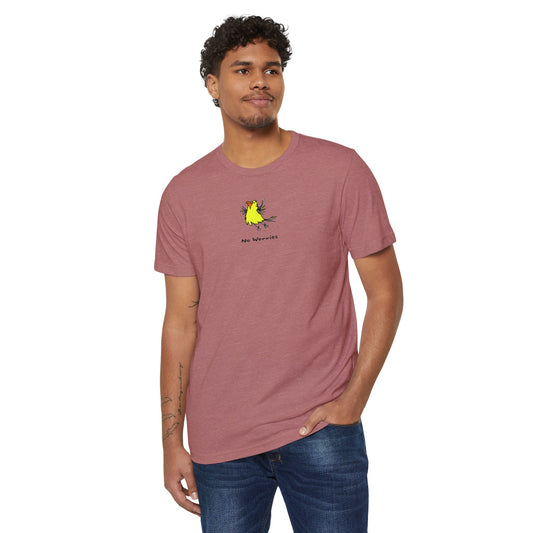 Man wearing a heather red or light red colored t-shirt featuring a small, centered linocut-style illustration of a happy looking flying yellow bird with an orange beak.  Below the artwork is the phrase “No Worries.”