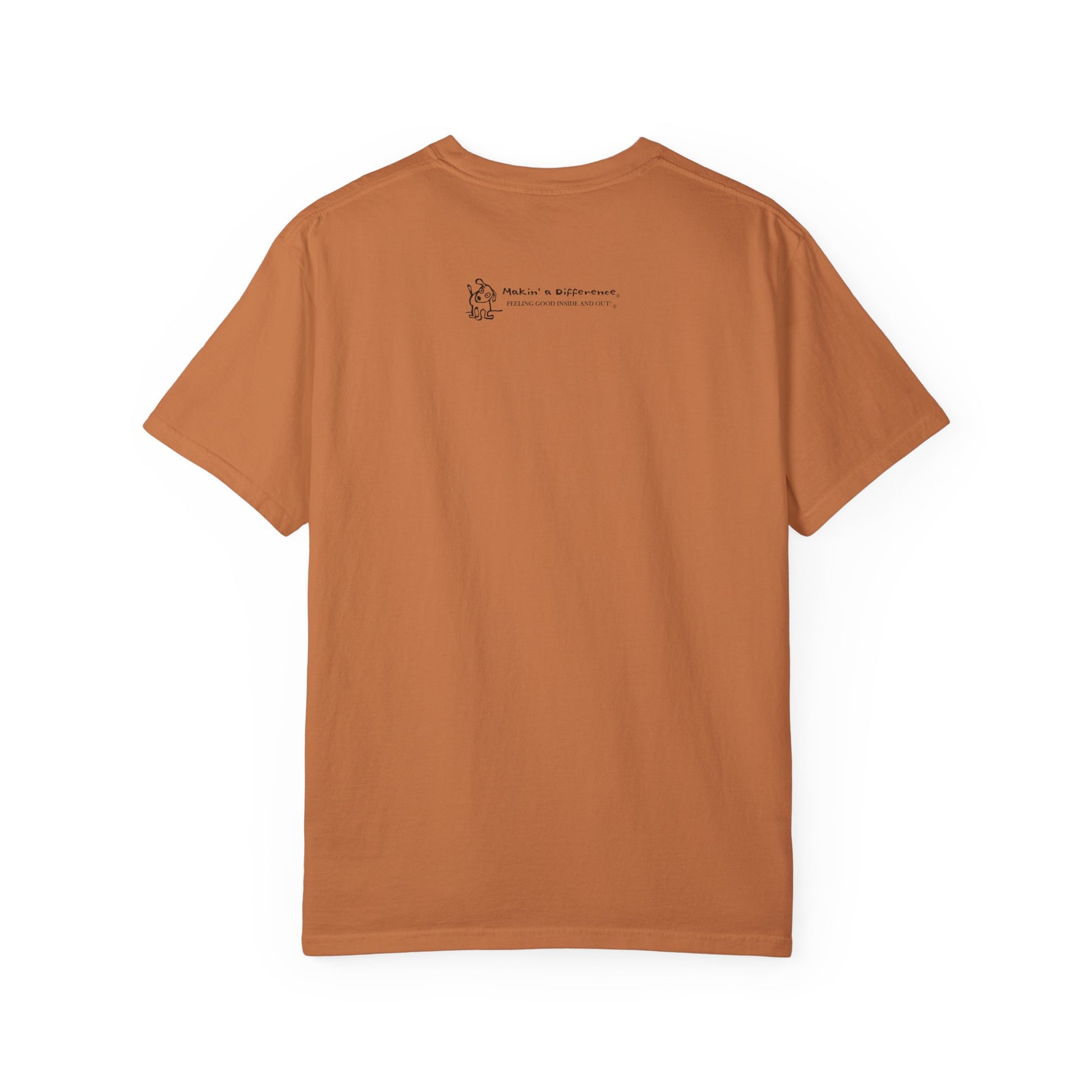 Dark orange or yam coloredt-shirt viewed from the back, featuring small black text and a simple cartoon graphic centered near the upper back. The text reads “Makin’ a Difference. makinadifference.com” with line below "Feeling Good Inside & Out" with a small illustration of a dog next to it.
