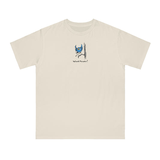 Cream colored or off-white t-shirt featuring a small, centered linocut-style illustration of a blue bird flapping its wings taking flight from a tree branch, with the caption “Wind Power!” below the artwork.