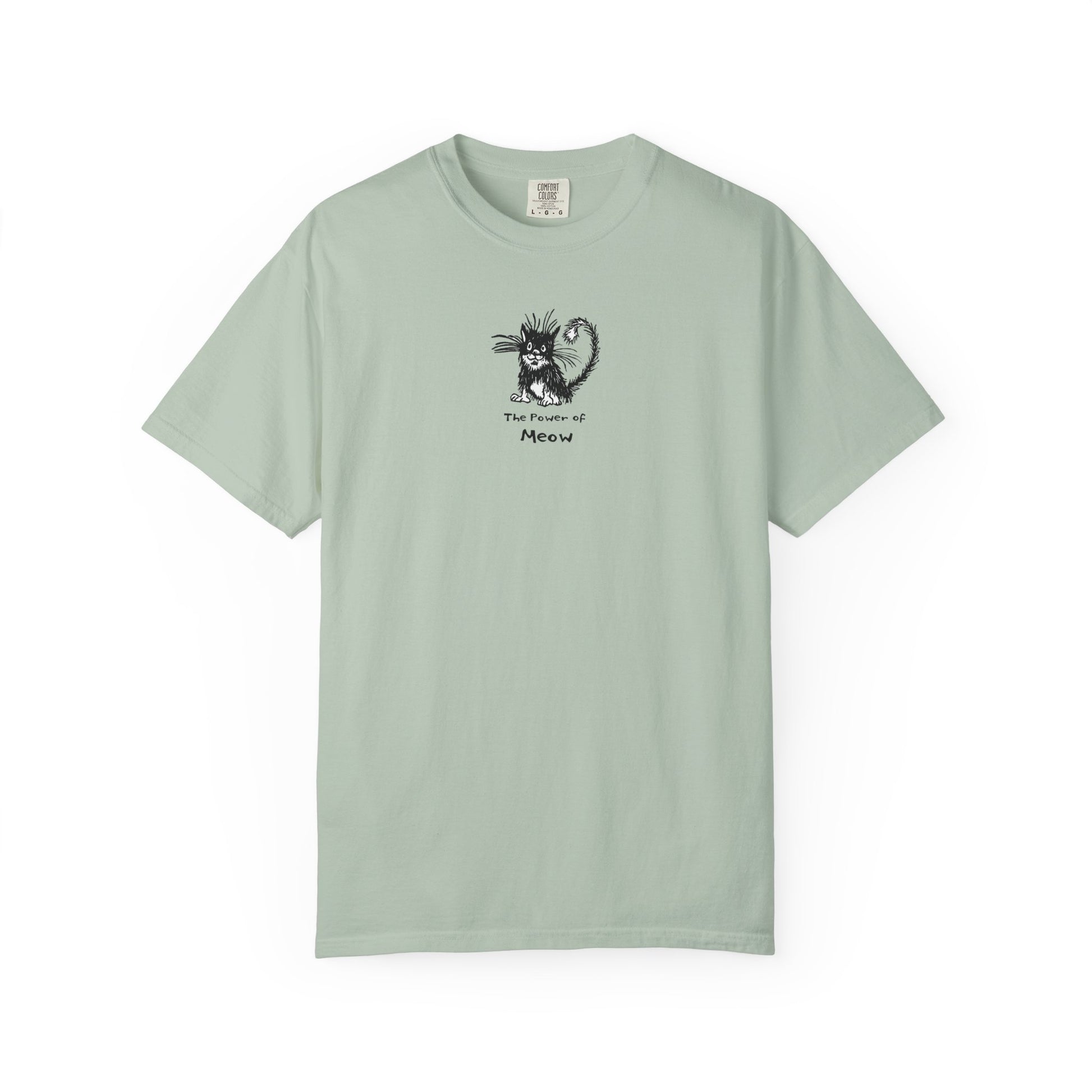 Light bluish-green t=shirt featuring a cartoon illustration of a scruffy black-and-white cat with its fur standing up, sitting calmly. Below the cat is the text “The Power of Meow” in a playful font.