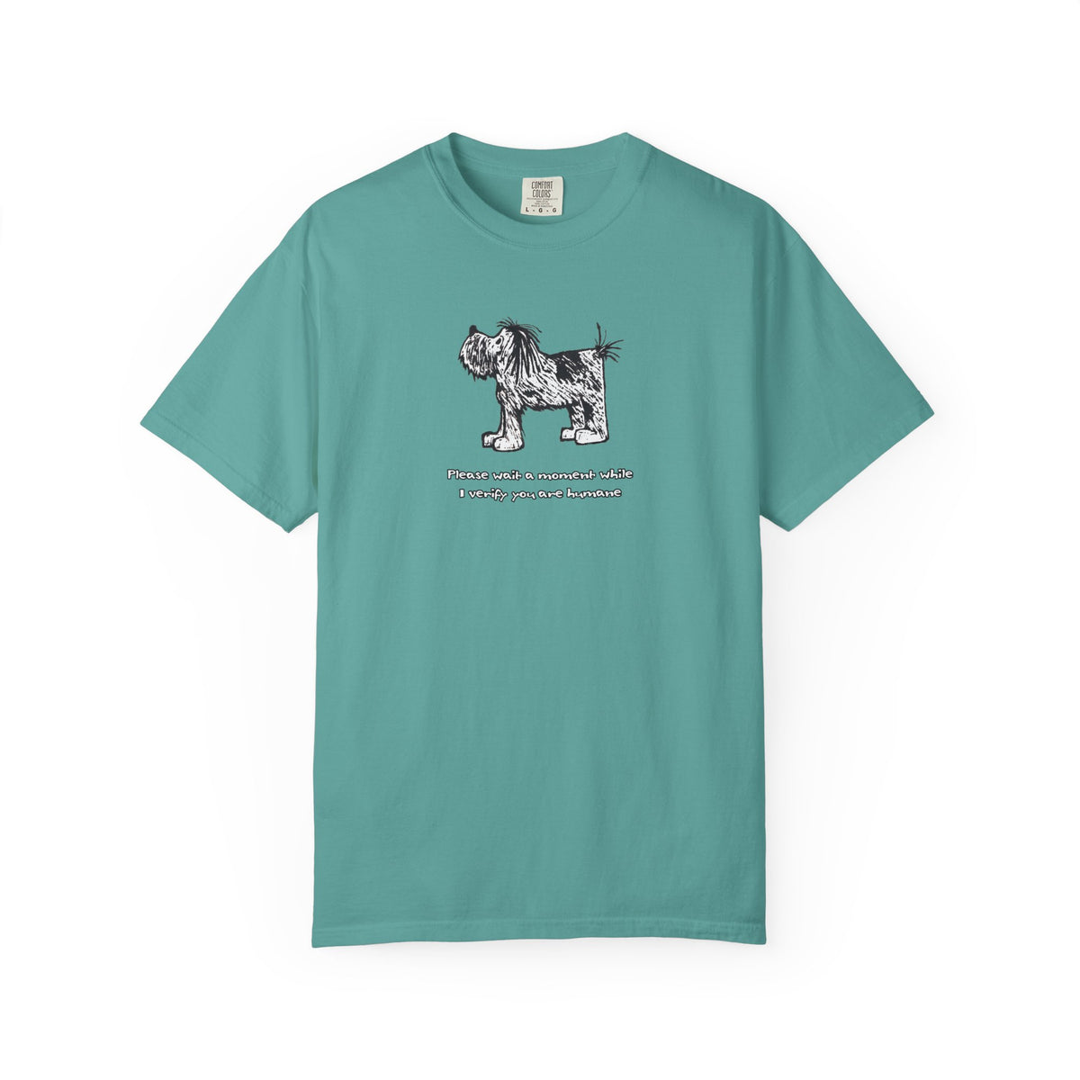 Comfort Colors unisex seafoam, blue-green short-sleeve crew neck T-shirt featuring shaggy dog artwork from an original linoleum block print by Barry Nelles, with the humorous text “Please wait a moment while I verify you are humane” printed below the image. Makin’ a Difference.
