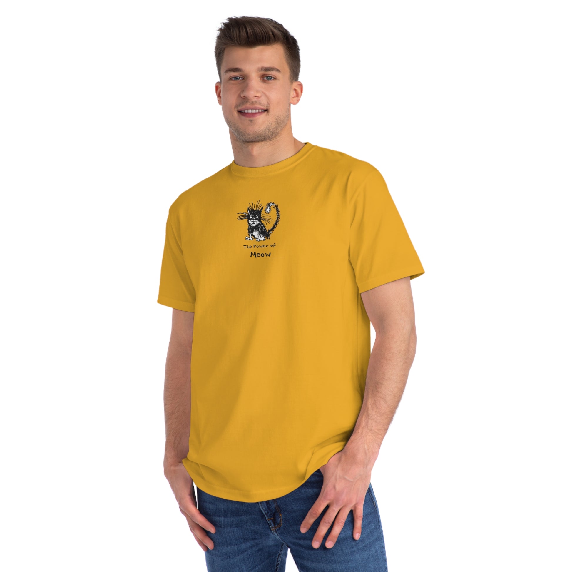 Man standing wearing beehive yellow organic unisex t-shirt featuring a humorous cartoon cat design with the text “The Power of Meow,” perfect for cat lovers.