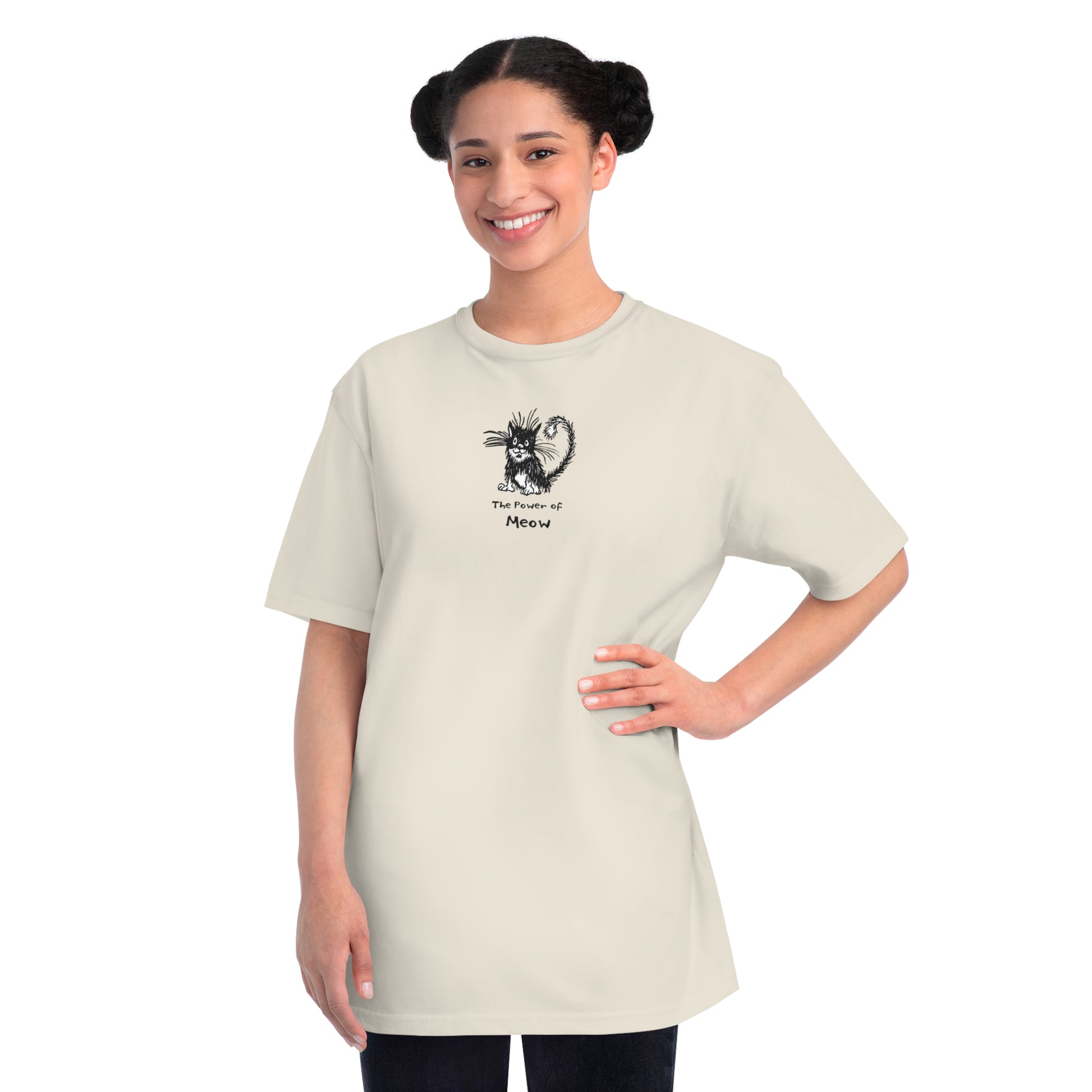 Woman standing wearing dolphin white organic cotton unisex t-shirt featuring a humorous cartoon cat design with the text “The Power of Meow,” perfect for cat lovers.