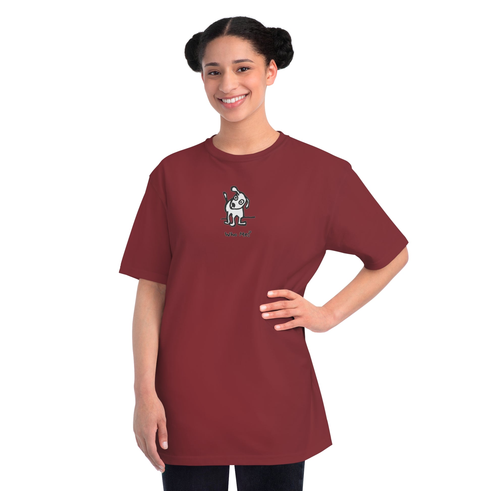 Woman in manzanita red organic unisex t-shirt featuring a playful, cartoon-style dog with one ear raised and a wagging tail, with the caption “Who Me?” printed below—a fun eco-friendly graphic tee for dog lovers.