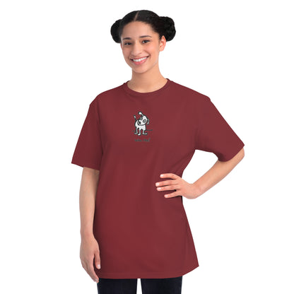 Woman in manzanita red organic unisex t-shirt featuring a playful, cartoon-style dog with one ear raised and a wagging tail, with the caption “Who Me?” printed below—a fun eco-friendly graphic tee for dog lovers.