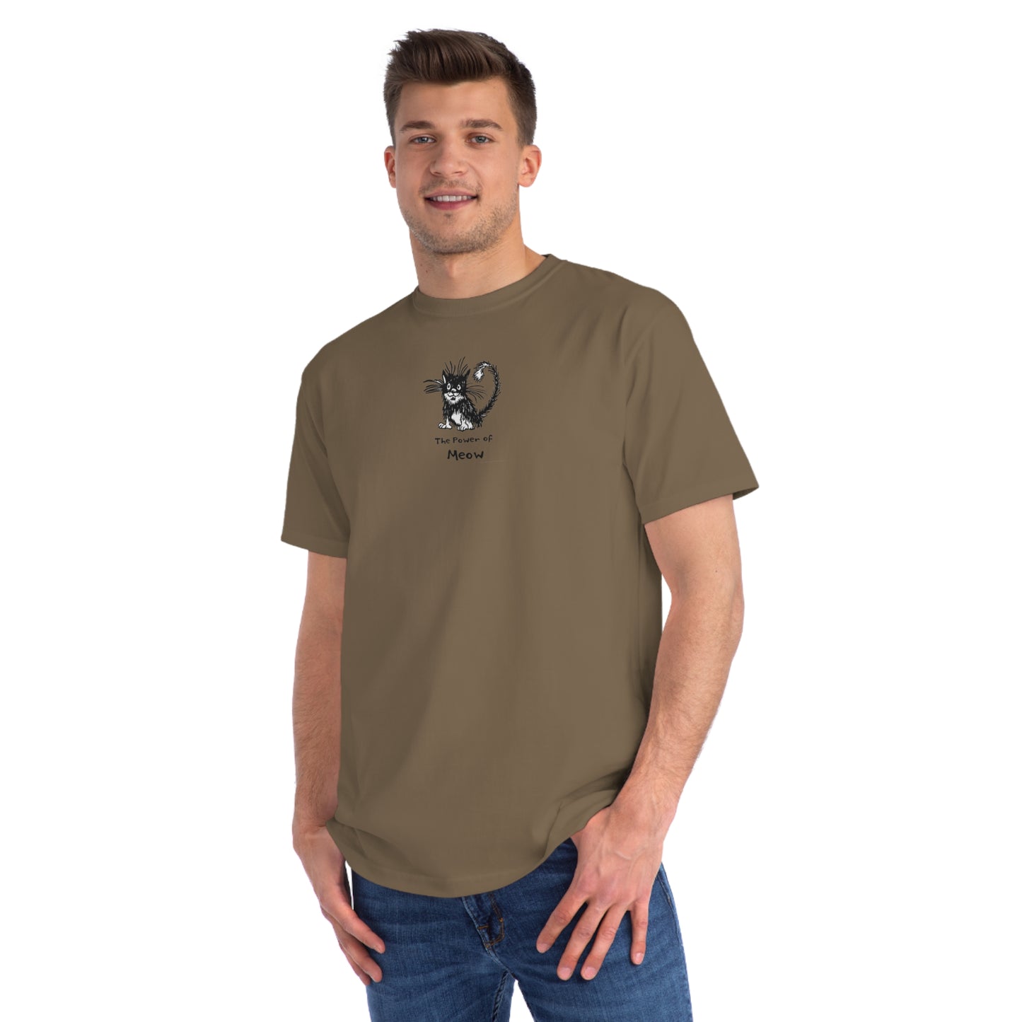 standing wearing meteorite brown organic unisex t-shirt featuring a humorous cartoon cat design with the text “The Power of Meow,” perfect for cat lovers.